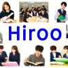 An image showing students of Hiroo Gakuen. They are interacting, studying, and participating in school activities, reflecting the diverse and international student body. Include the text 'HIROO' prominently in the image.