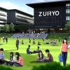 A vibrant scene at ZuIRyo High School, showcasing its popularity among students. The image features a diverse group of students engaged in various activities across the campus. Some are participating in outdoor classes, while others are enjoying leisure activities like reading and socializing in green, park-like areas of the school. Modern school buildings provide a backdrop, creating a dynamic and inviting educational environment. Prominently, the word 'ZUIRYO' is displayed in bold English letters, symbolizing the school's strong identity and appeal to students.